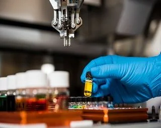 Glass sample vial on an automated lab instrument tray